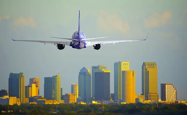 plane over city traveling